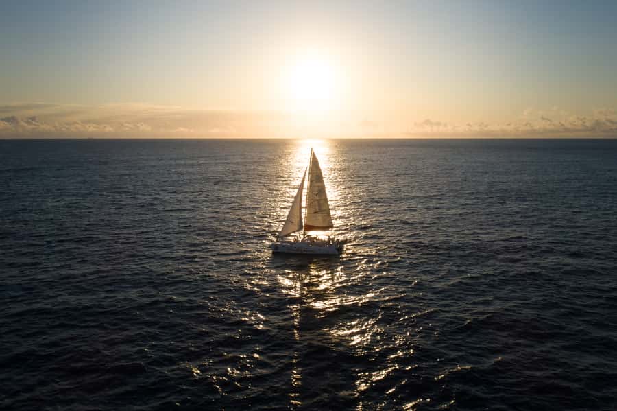 Grand Baie: Private 4-Hour Premium Sunset and Dinner Cruise - Meeting Coin de Mire’s sea cliffs